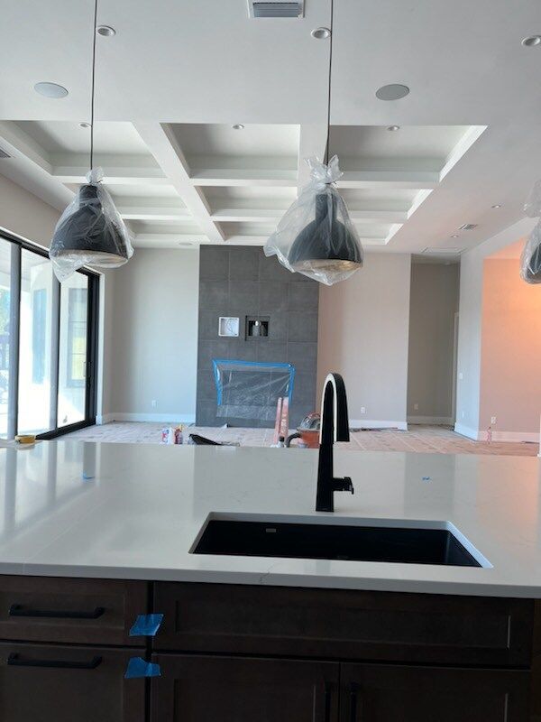 A kitchen with a sink and a faucet in it