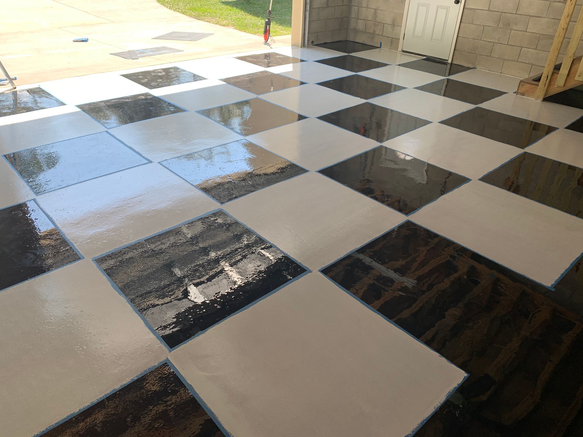 A black and white checkered floor in a garage.