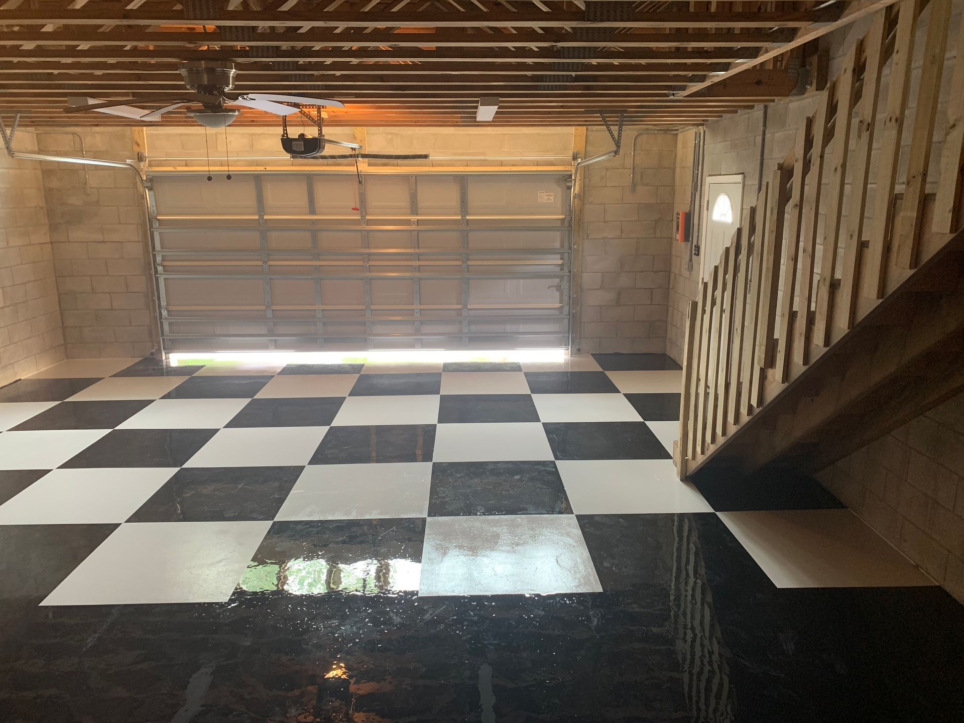A black and white checkered floor in a garage