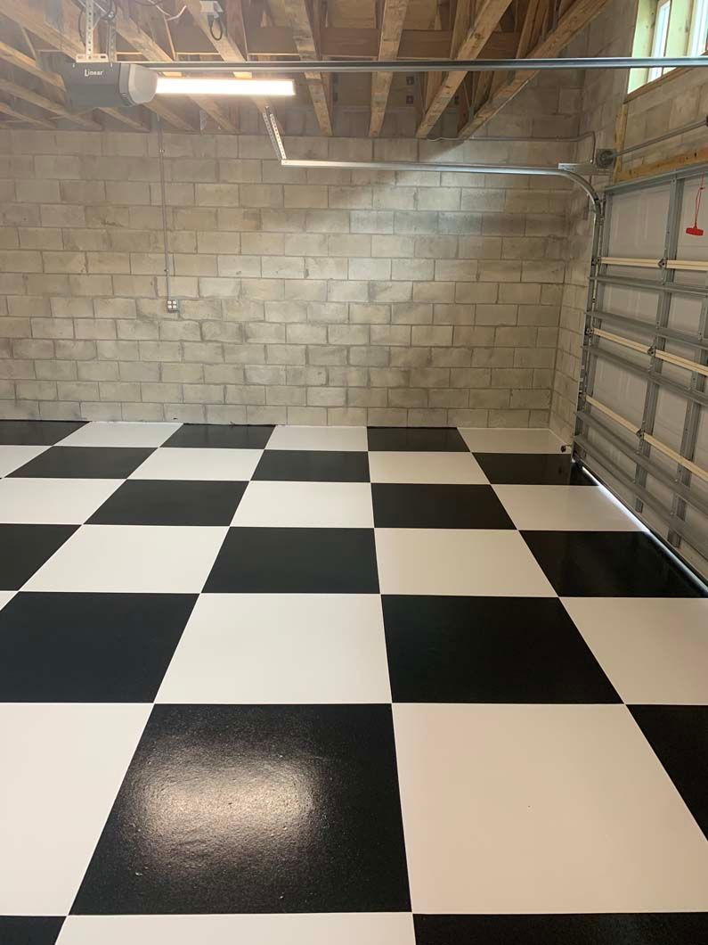 A black and white checkered floor in a garage