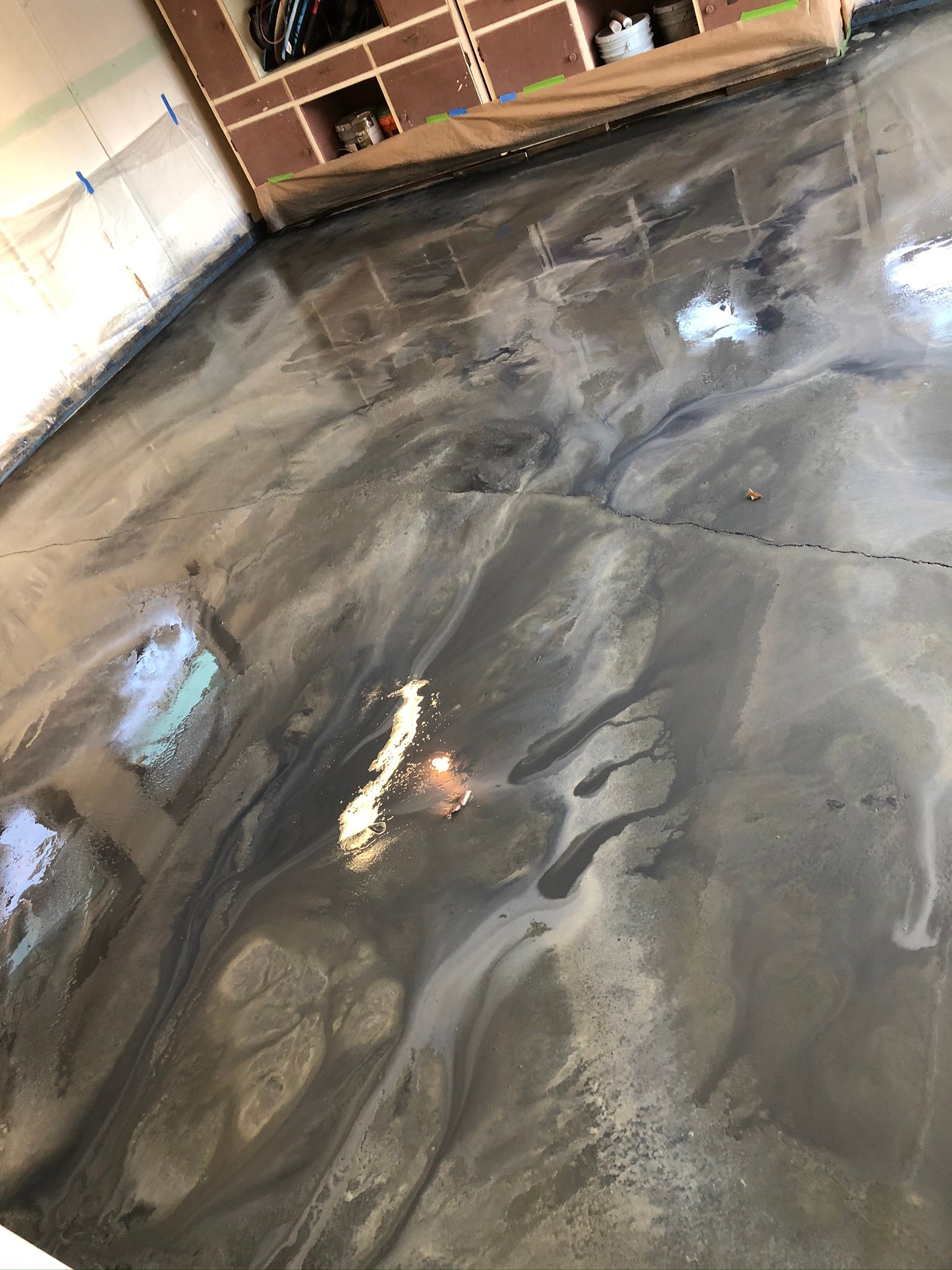 Metallic gray epoxy floor with flowing patterns.