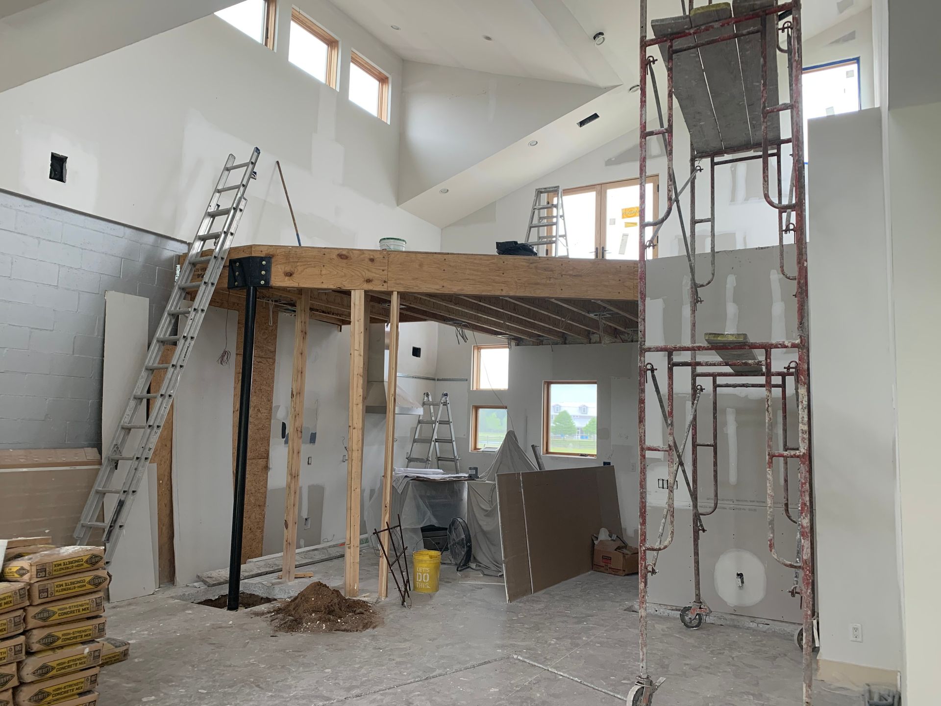 A room with a ladder and scaffolding in it