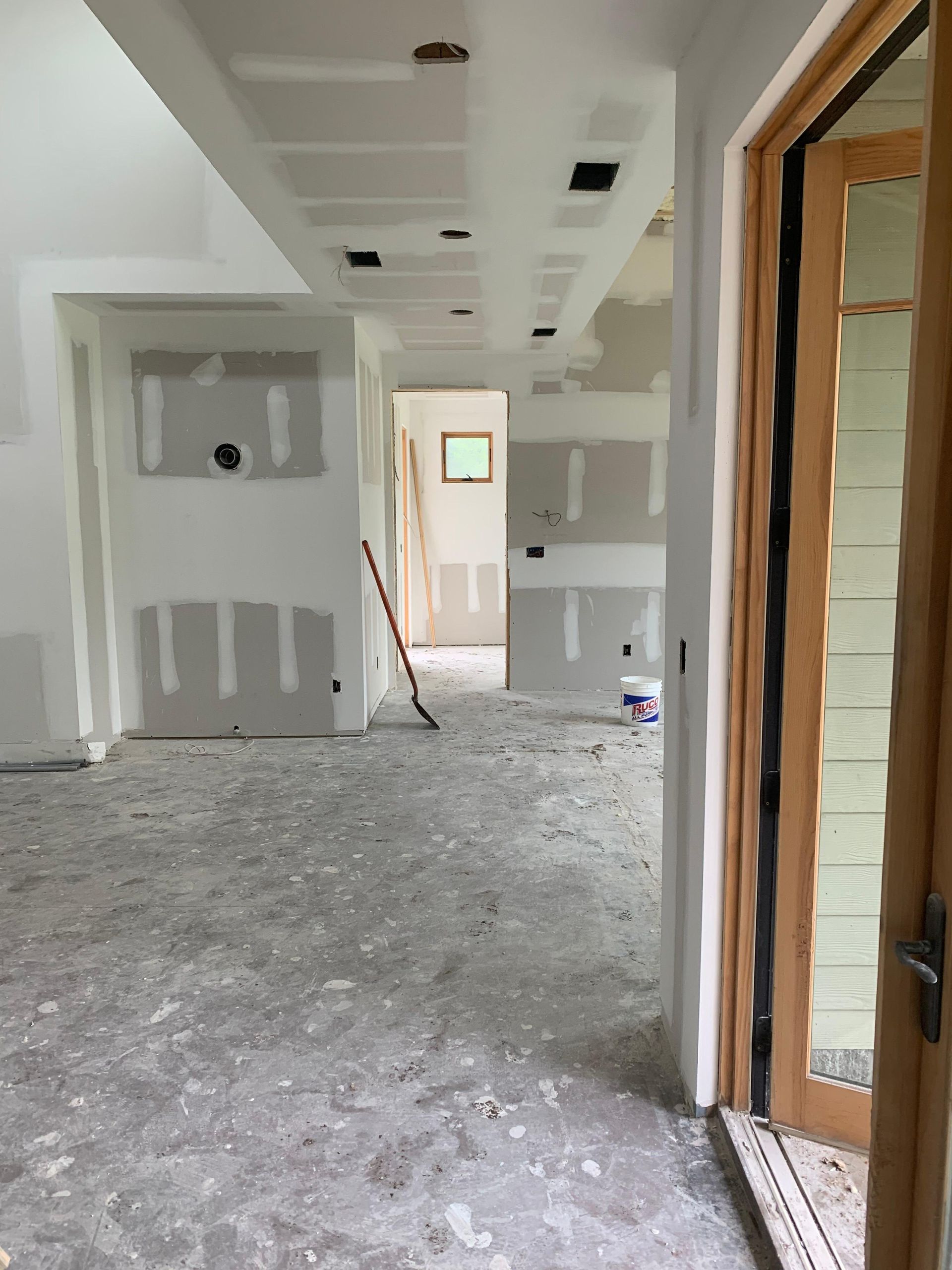 A hallway in a house that is being remodeled