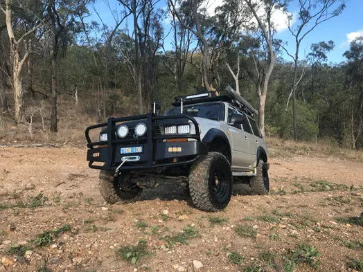 Silver Off-road Suv With Black Accents in a Forest Setting — Fitzroy Towing & Transport in Biloela, QLD