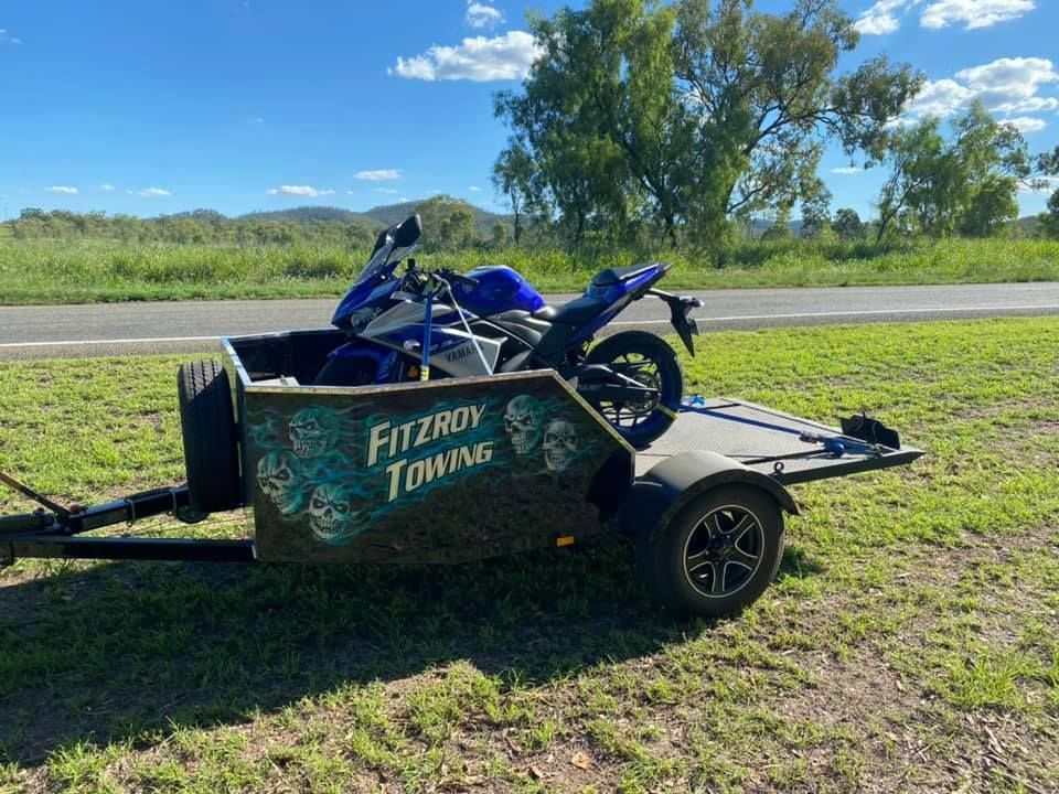 Motorcycle Loaded on a Fitzroy Towing Trailer Outdoors — Fitzroy Towing & Transport in Emerald, QLD