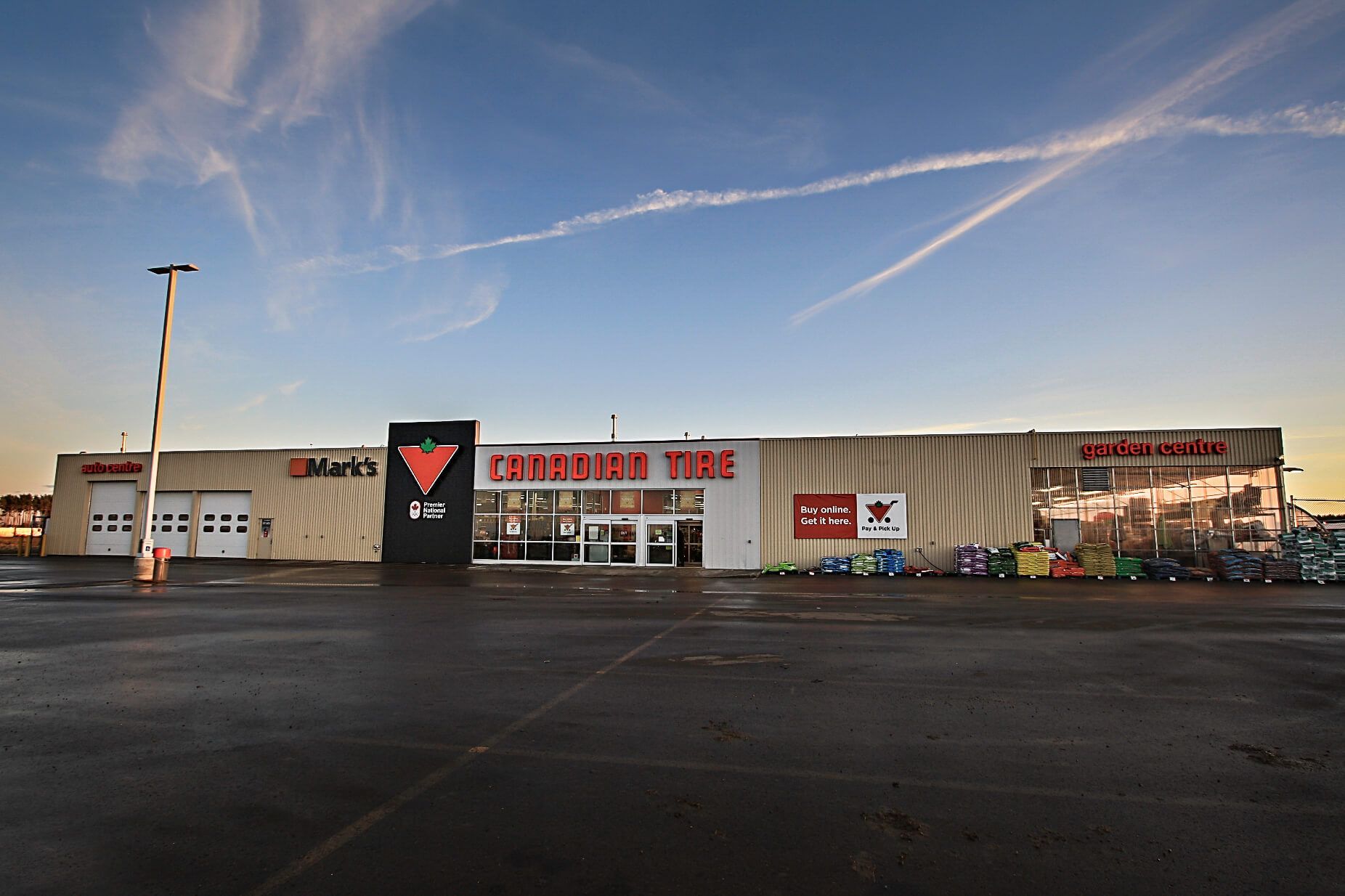 A large building with tractor tire written on it
