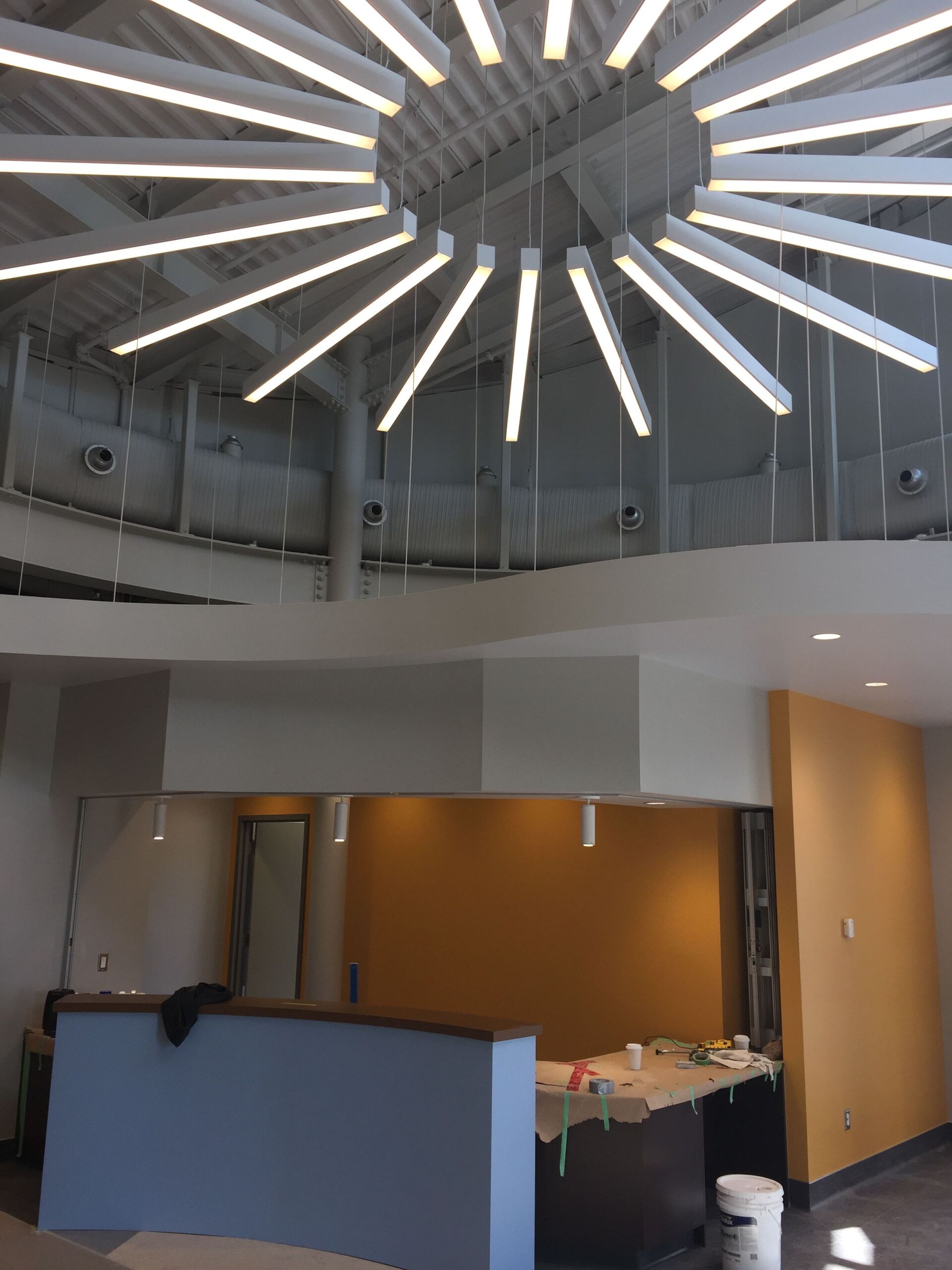 A room with a lot of lights hanging from the ceiling