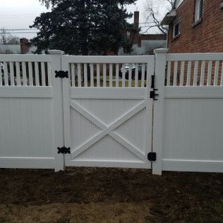 White picket fence with matching gate.