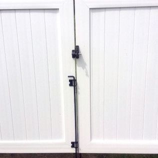 White double gate with black latch and bolt.