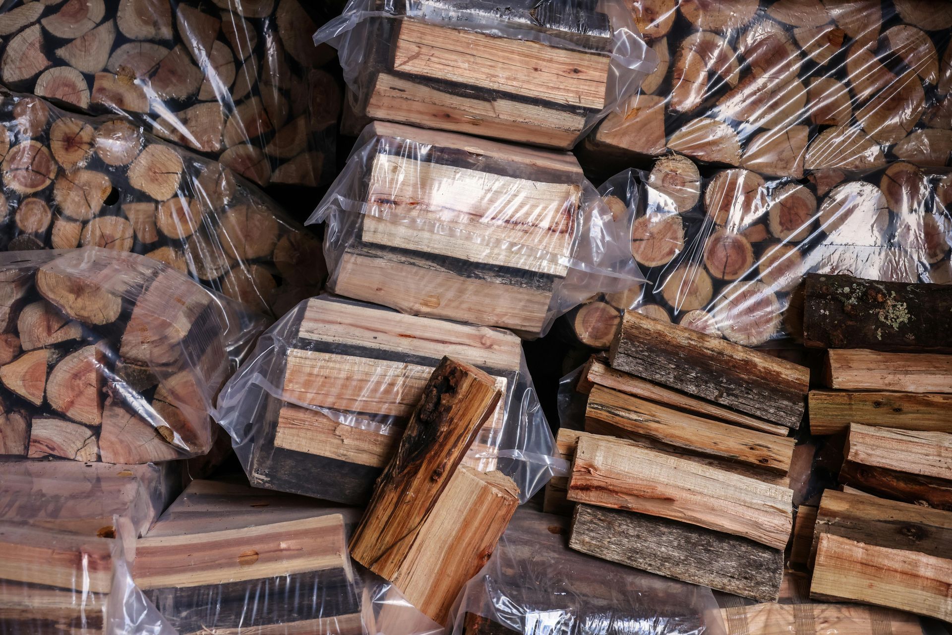 Two-story house with white deck, steps, and railing. Light tan siding, green lawn, white door.