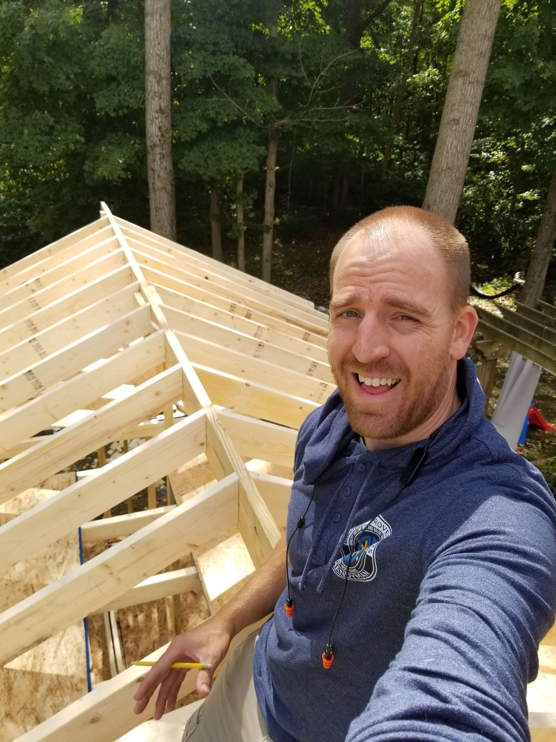 Builder on top of unfinished roof for home office addition
