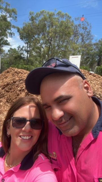 Man and women wearing  matching shirts — Gladstone Garden & Landscaping Supplies in Burua, QLD