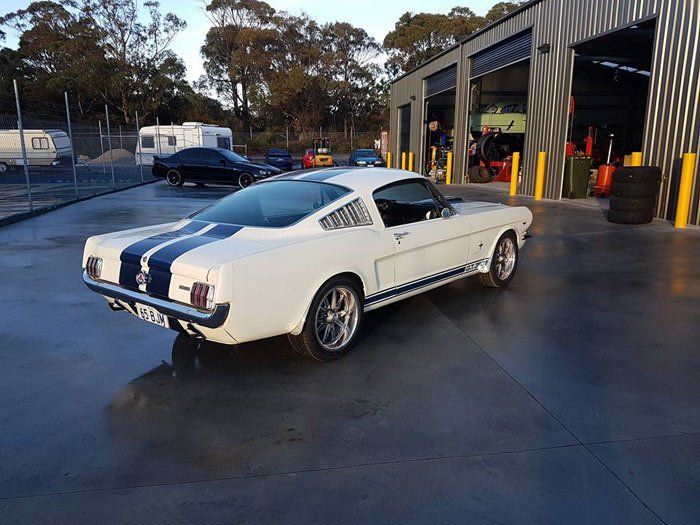 View of repaired car with white and black stripes