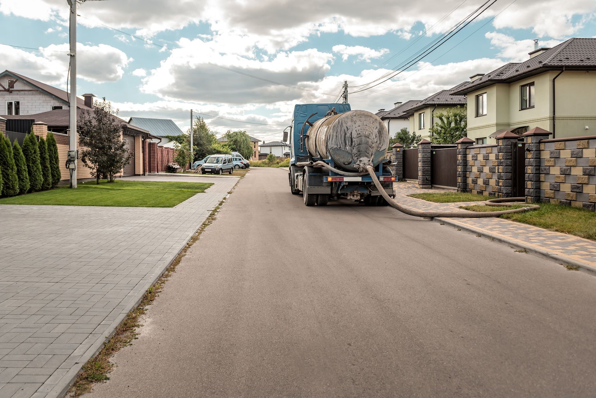 Sewage Tank truck. Sewer pumping machine on the street - Septic Tank Pumping Sewage Tank truck. Sewer pumping machine on the street - Septic Tank Pumping