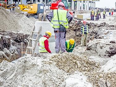 workers working at the project site for septic system installation