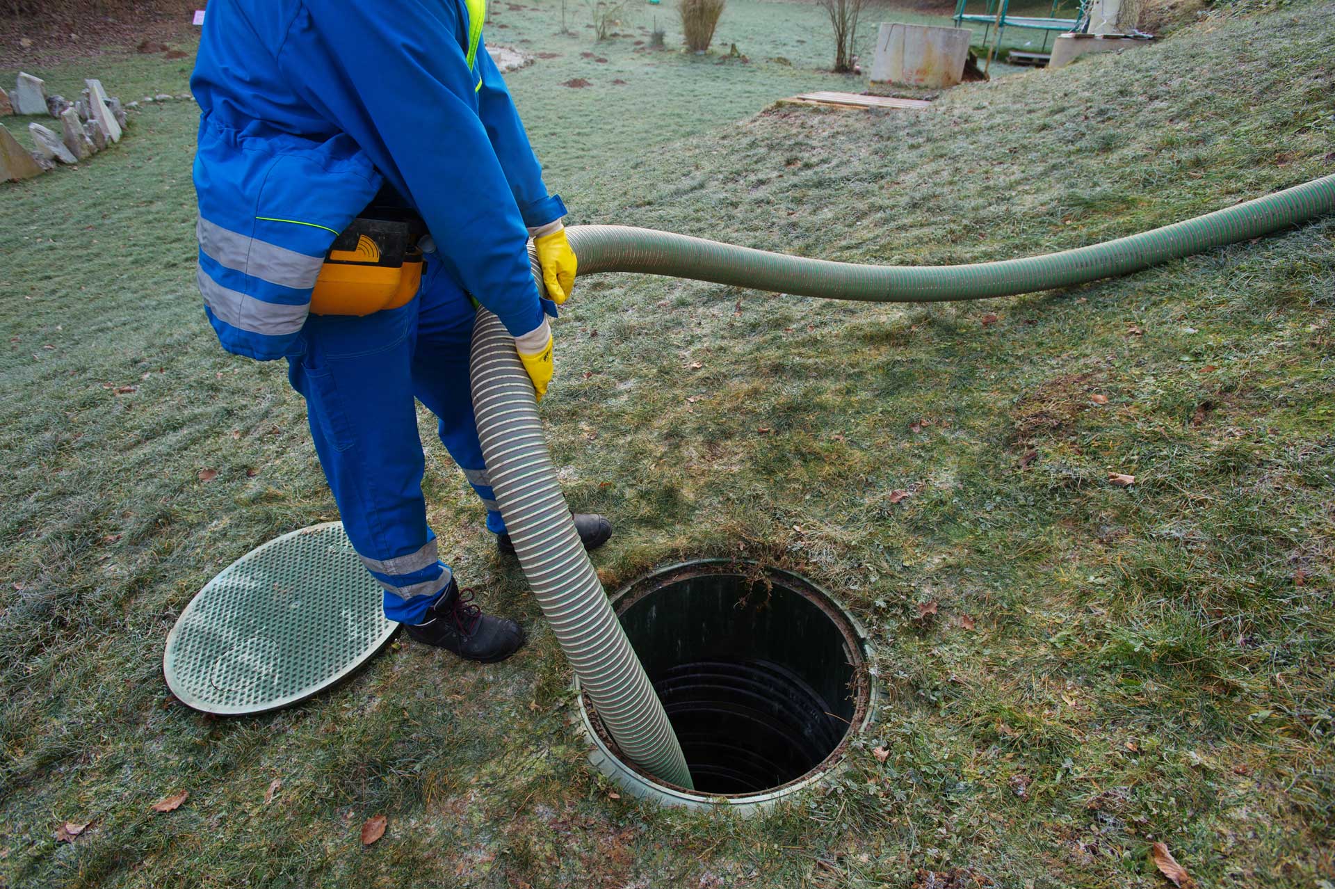 worker leveling the floor for septic tank installation