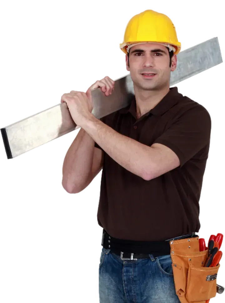 A man wearing a hard hat is carrying a level on his shoulder