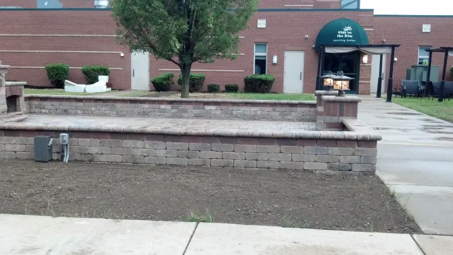 A large brick building with a green awning over the entrance