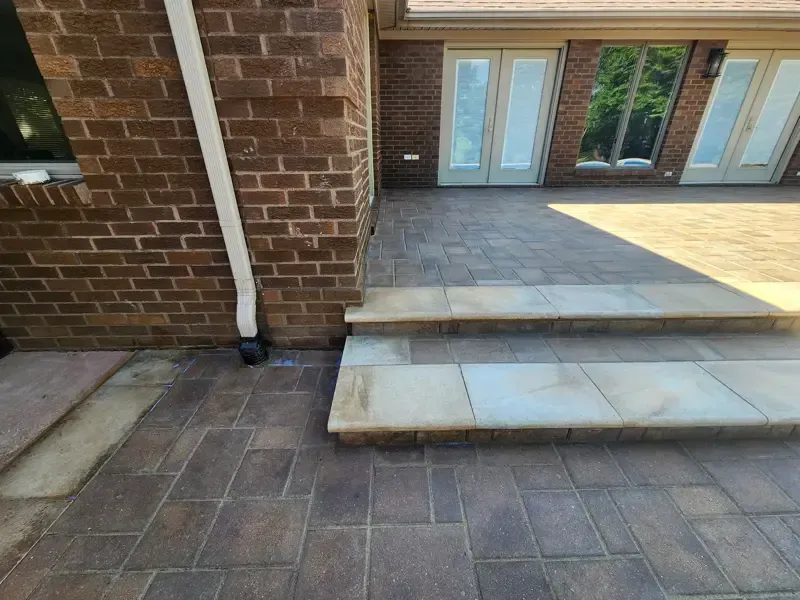 A brick building with stairs leading up to it