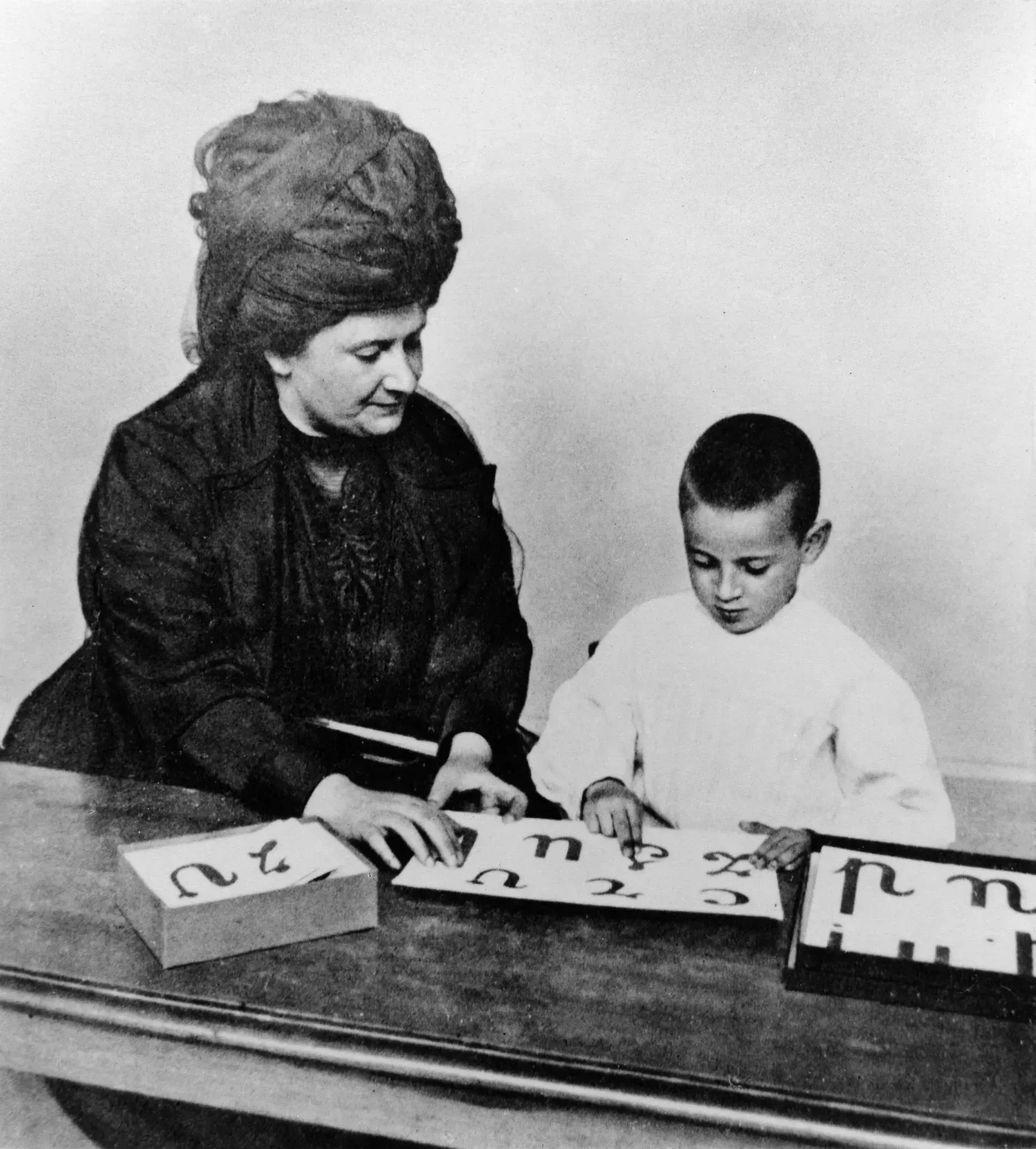 Dr. Maria Montessori giving a lesson to a student