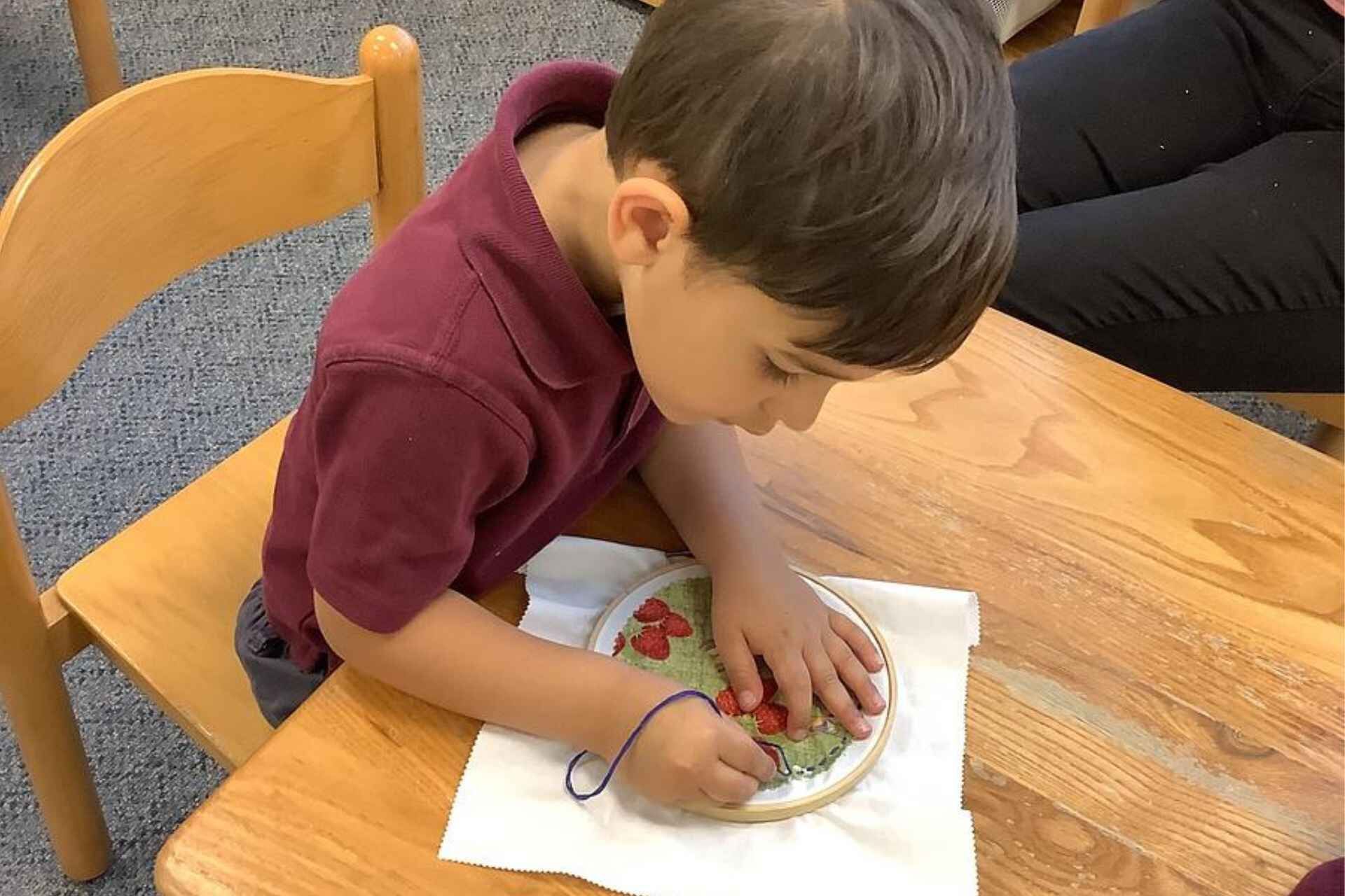 Montessori works with focus, showing persistence and independence in work.