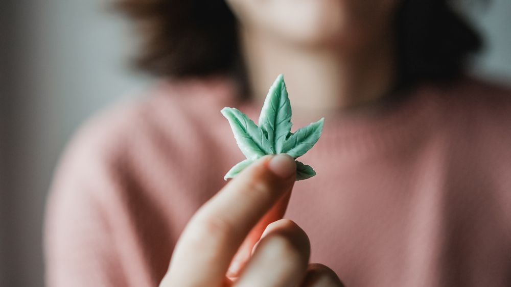 A woman holding an edible CBD