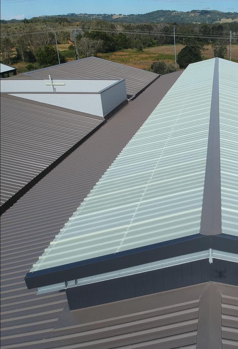 An Aerial View of a Building 's Roof With Trees in the Background  — Northern Rivers Metal Roofing PTY LTD In Alstonville, NSW