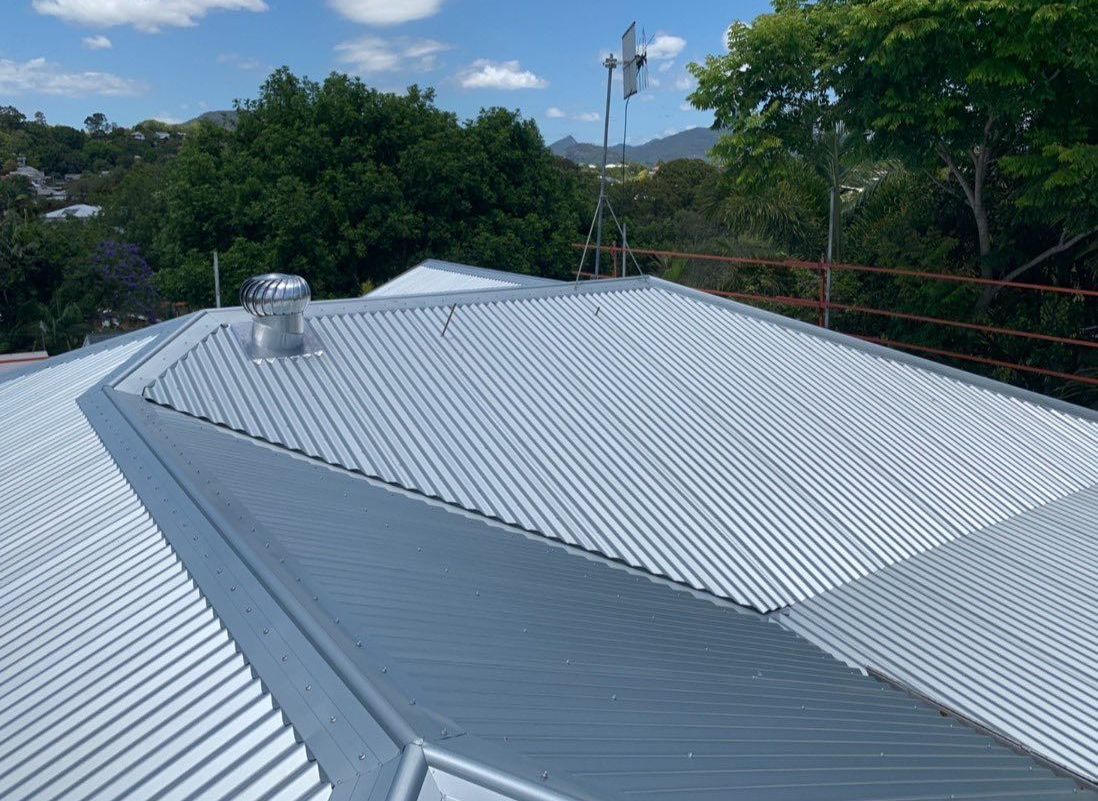The Roof of a House With a Bird Sitting on Top of It  — Northern Rivers Metal Roofing PTY LTD In Byron Bay, NSW