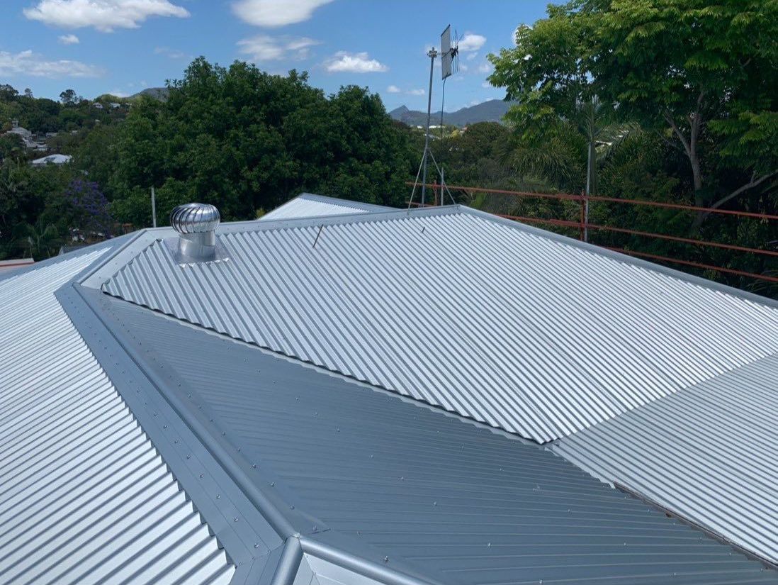 A White Corrugated Metal Roof With a Chimney on Top of It — Northern Rivers Metal Roofing PTY LTD In Ewingsdale, NSW
