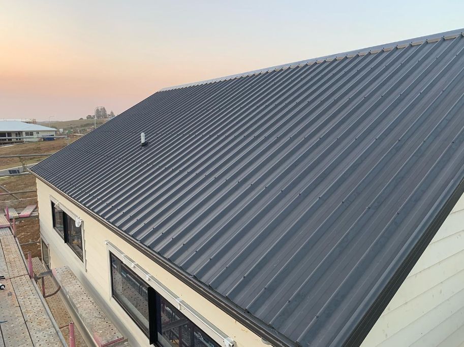 newly installed metal roof on a residential home in Northern Rivers at sunset