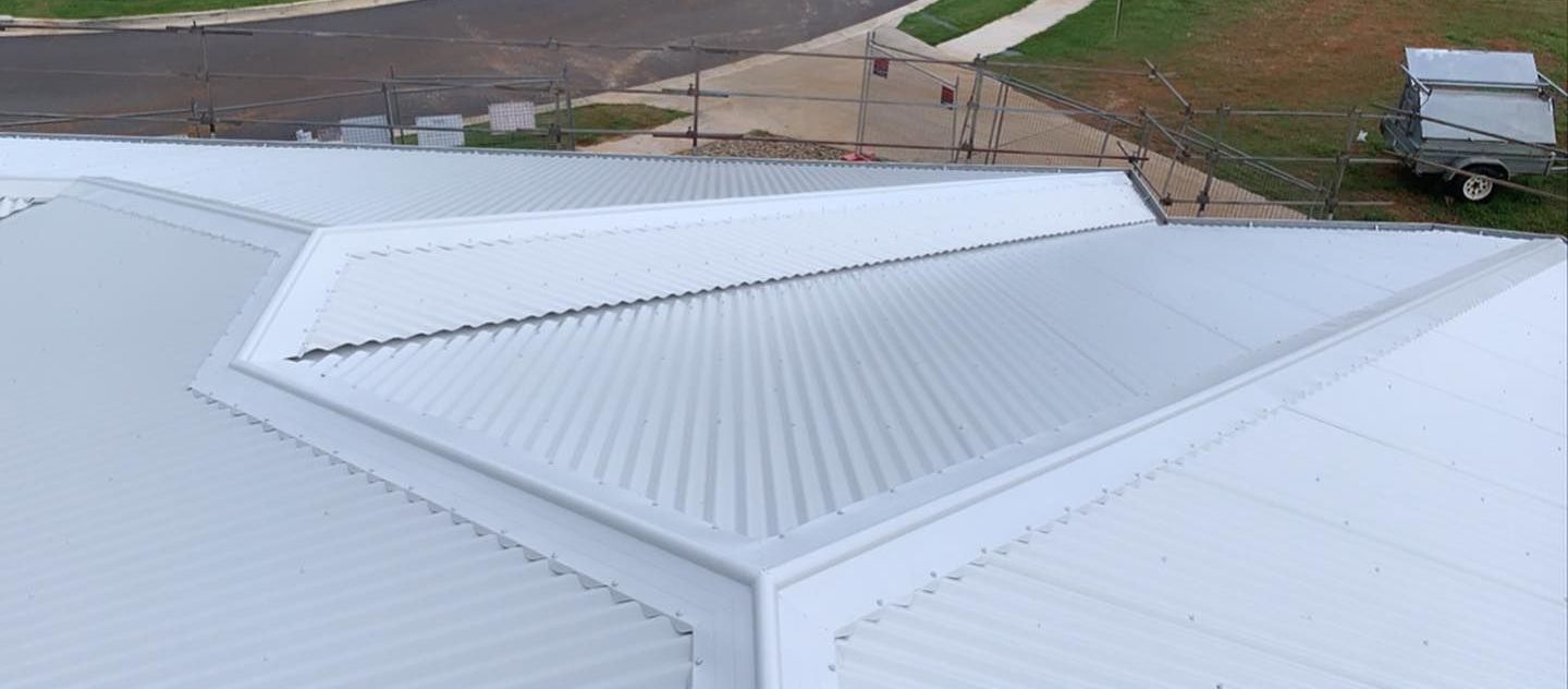 An Aerial View of a White Roof — Northern Rivers Metal Roofing PTY LTD In Ewingsdale, NSW