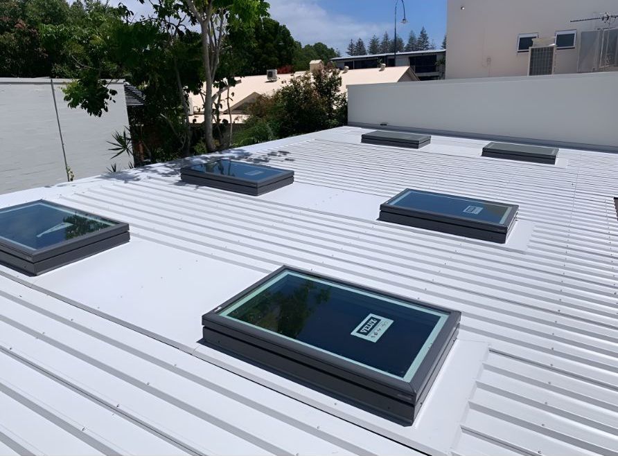 A White Roof With Three Skylights on It — Northern Rivers Metal Roofing PTY LTD In Mullumbimby , NSW