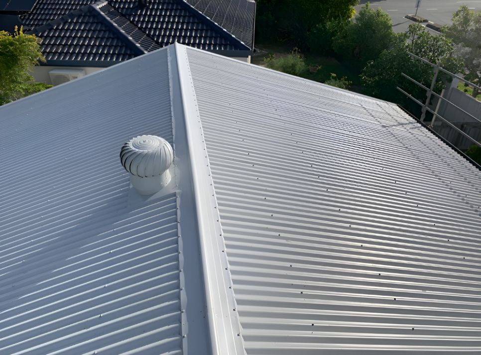 A White Roof With a Fan on Top of It — Northern Rivers Metal Roofing PTY LTD In Ewingsdale, NSW
