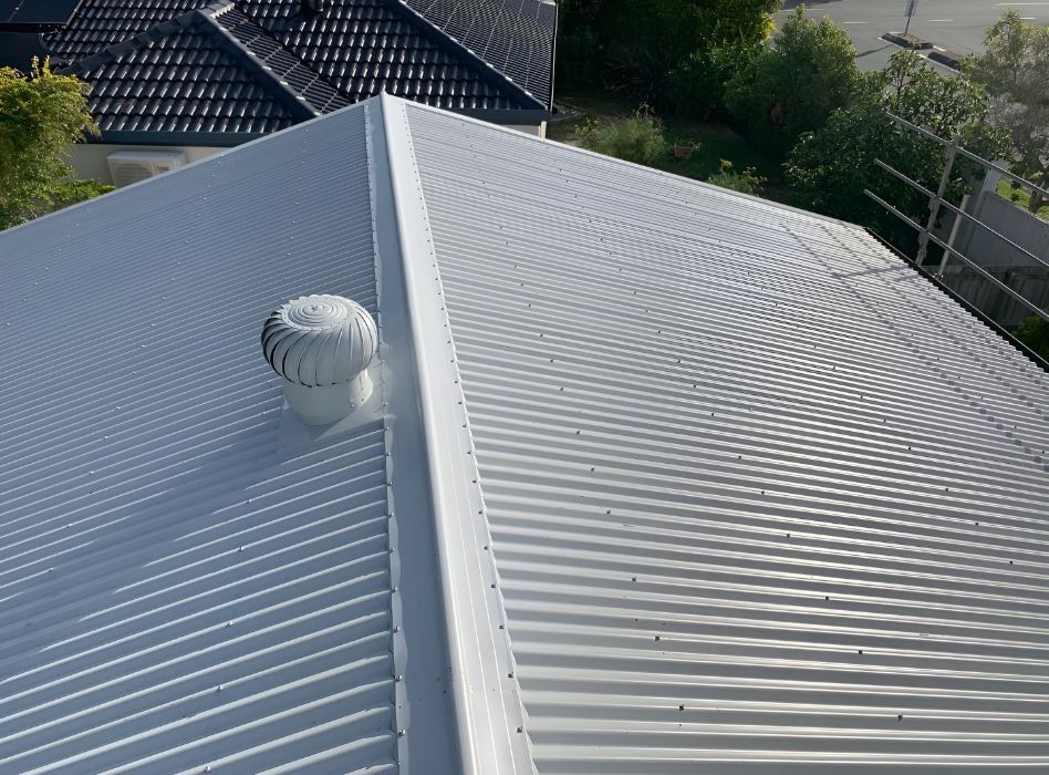 A White Roof With a Fan on Top of It — Northern Rivers Metal Roofing PTY LTD In Kingscliff, NSW