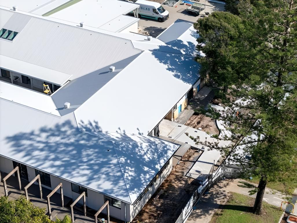 White-roofed Building Complex — Northern Rivers Metal Roofing PTY LTD In Coffs Harbour, NSW