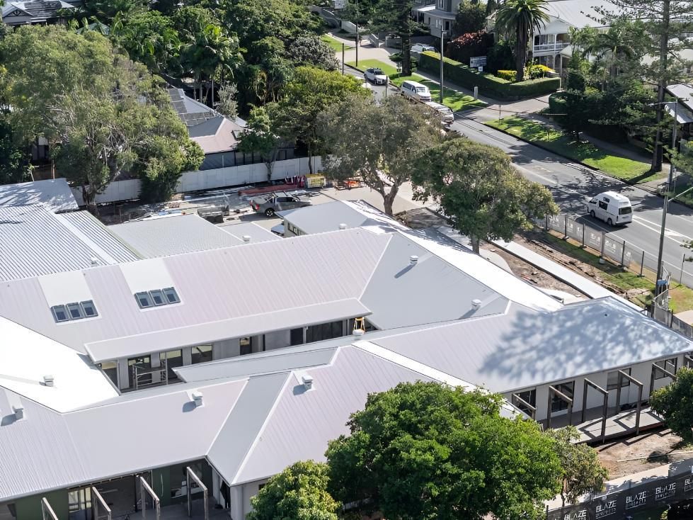 Building With a White Roof Under Construction — Northern Rivers Metal Roofing PTY LTD In Ballina, NSW