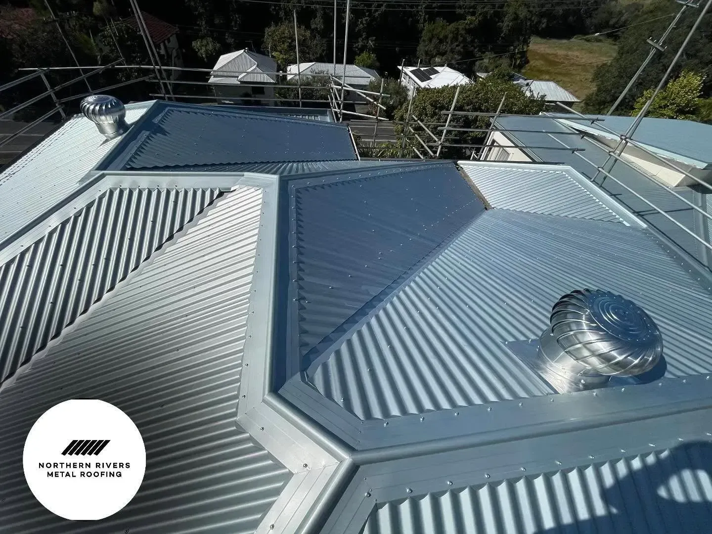 An Aerial View of a Roof With a Fan on It — Northern Rivers Metal Roofing PTY LTD In Ewingsdale, NSW
