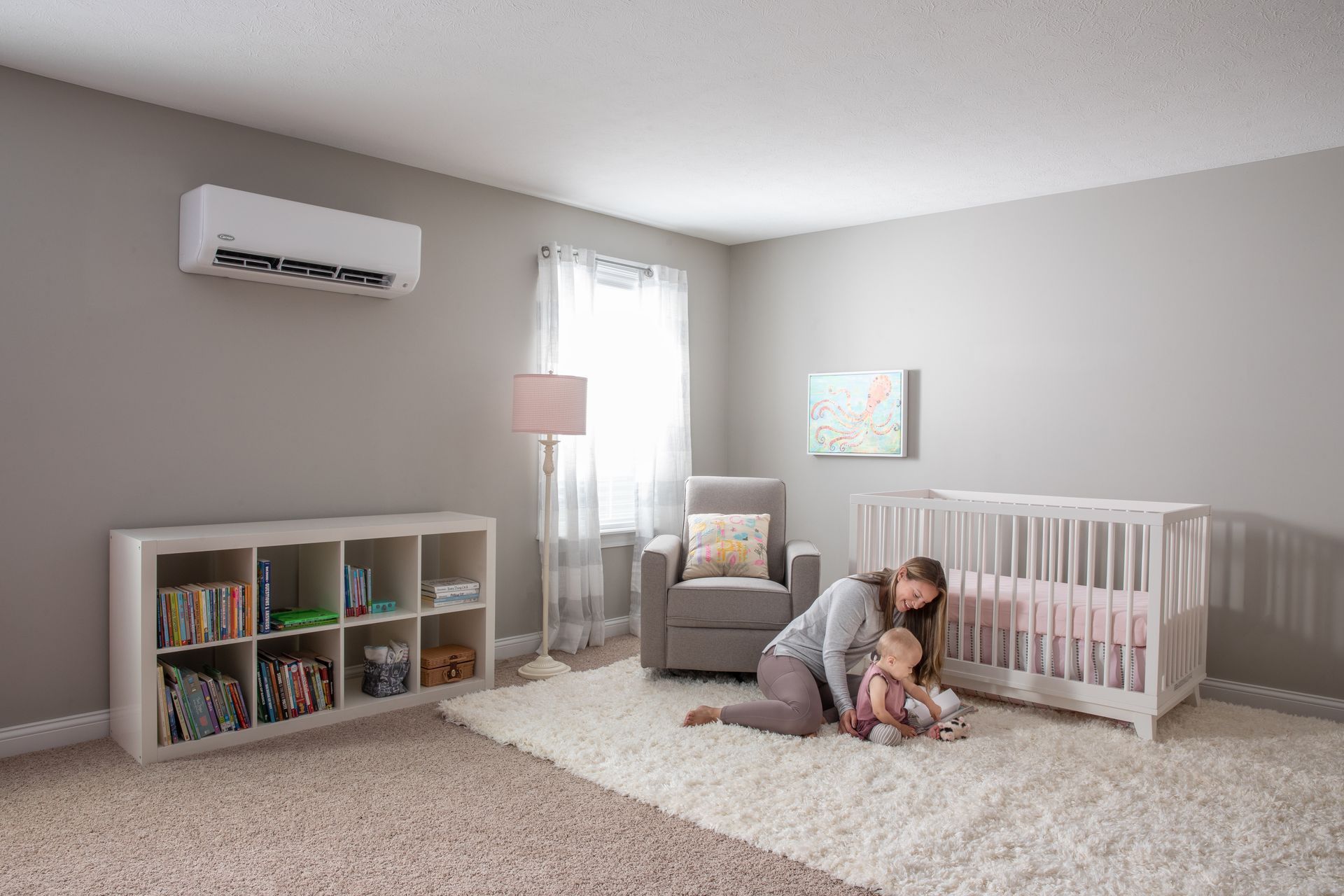 A white air conditioner is hanging on a wall.