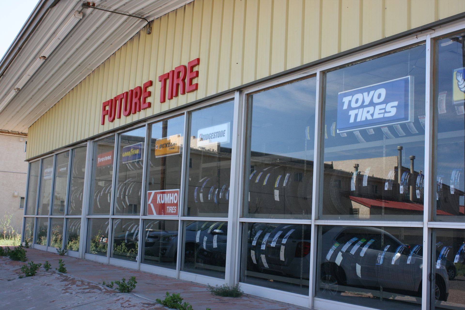 Holbrook store front with a toyo tires sign on it