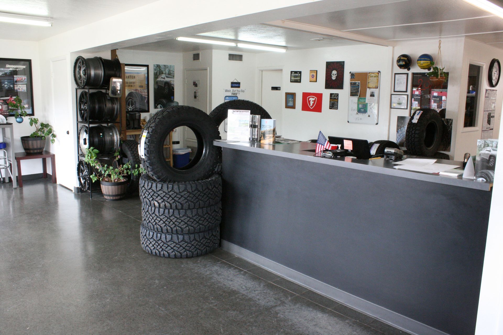 A stack of tires sits on a counter in a store at Show Low.