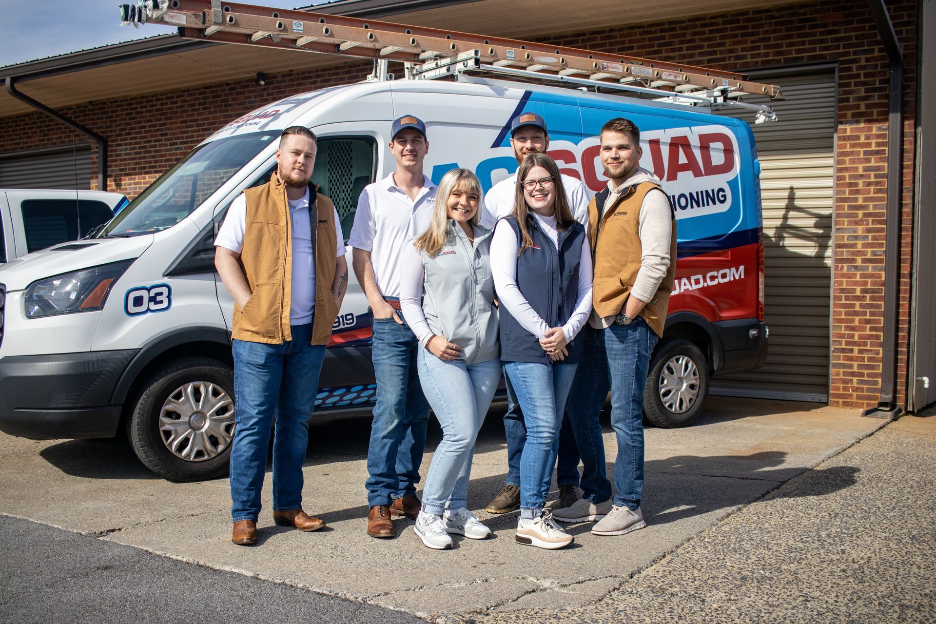 An aerial view of a residential neighborhood with lots of houses and trees.