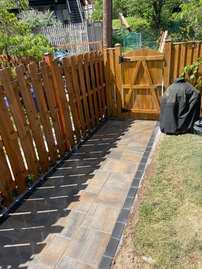 There Is A Wooden Fence And A Wooden Gate In The Backyard - Perry Hall, MD - Oakwood Landscaping LLC