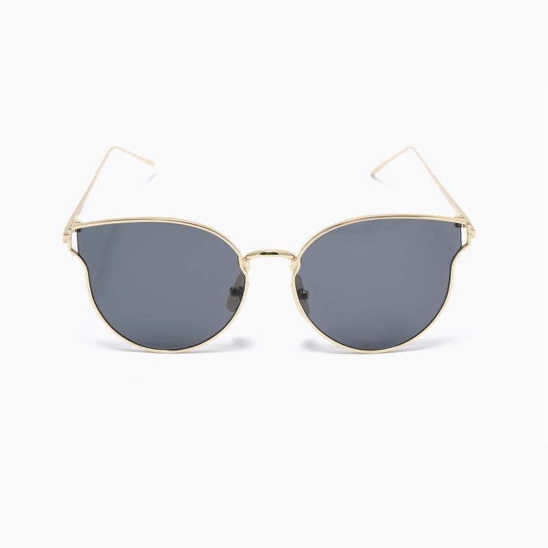 A pair of sunglasses with a gold frame and black lenses