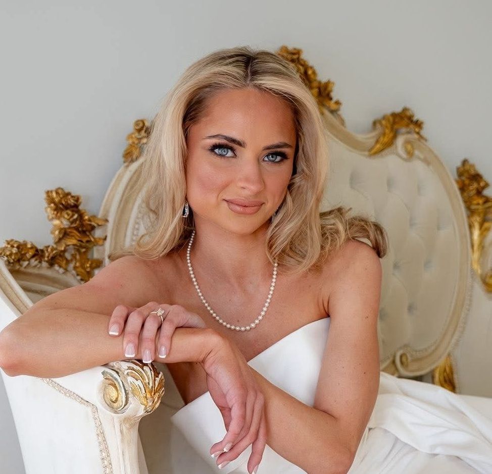 A bride and groom are posing for a picture on their wedding day.