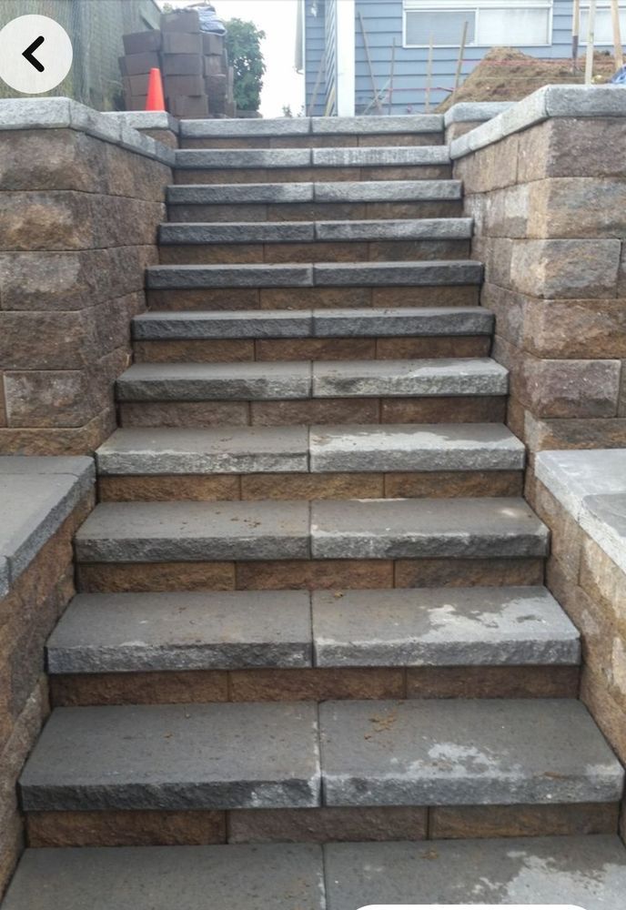 A set of stone stairs leading up to a house