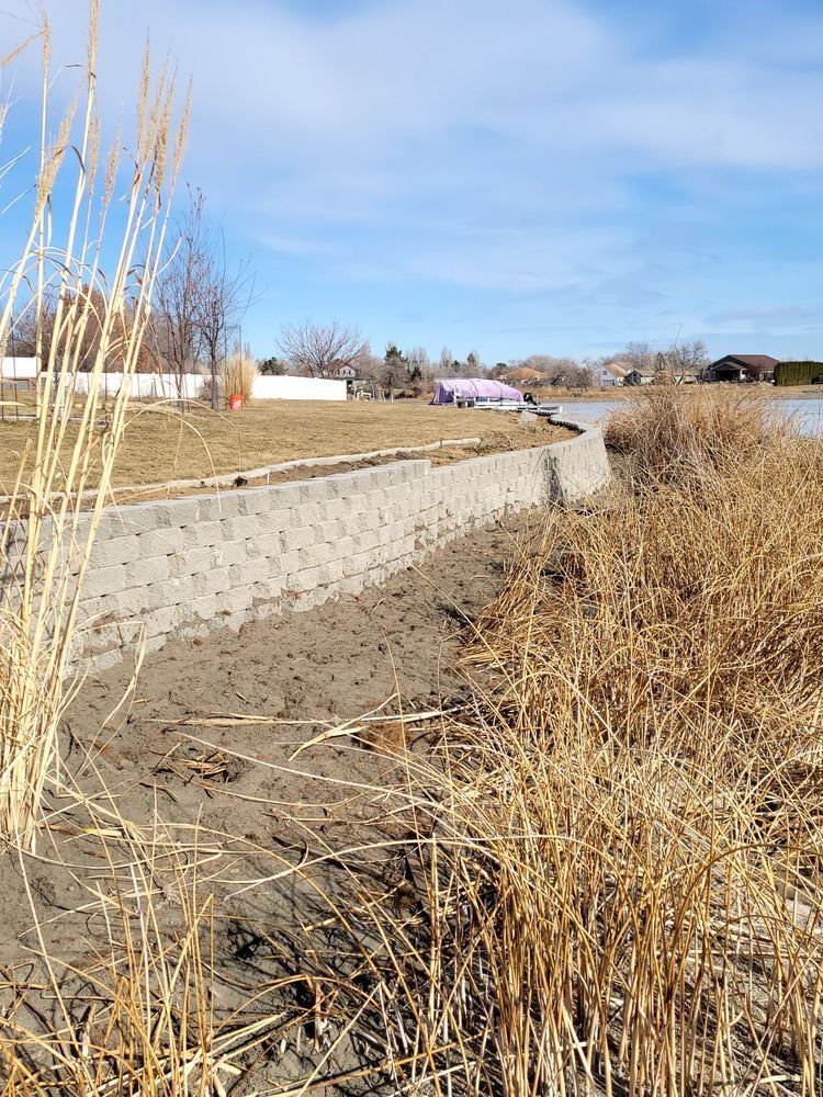 A path going through a field next to a body of water.