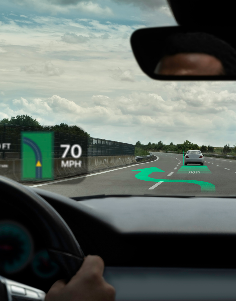 HUD displays speed and navigation on a road with a car.