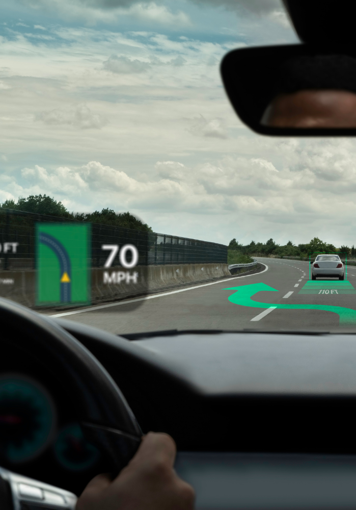 HUD displays speed and navigation on a road with a car.