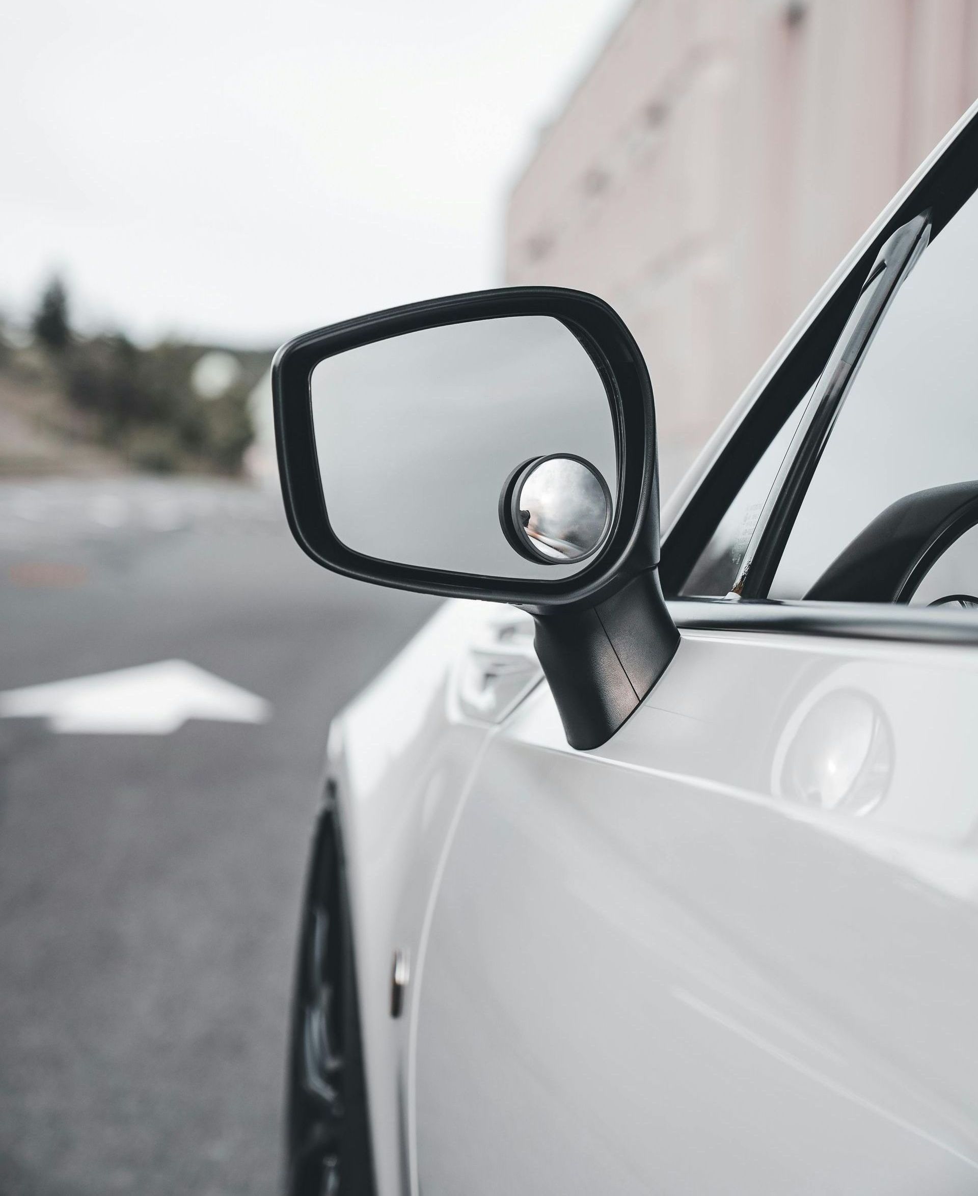 A close up of a car 's side view mirror