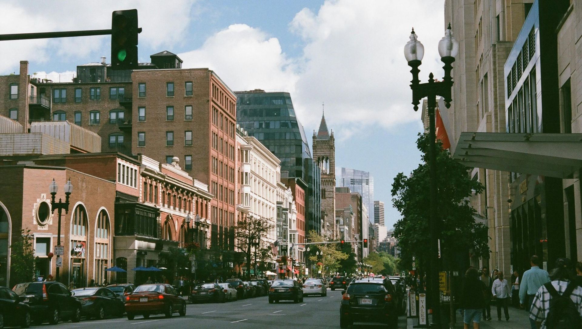 A city street with cars parked on the side of it